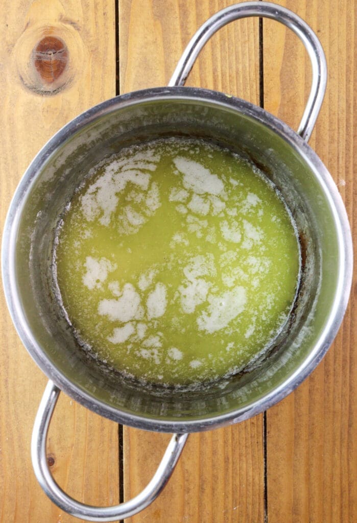 Melted butter in a small pan.